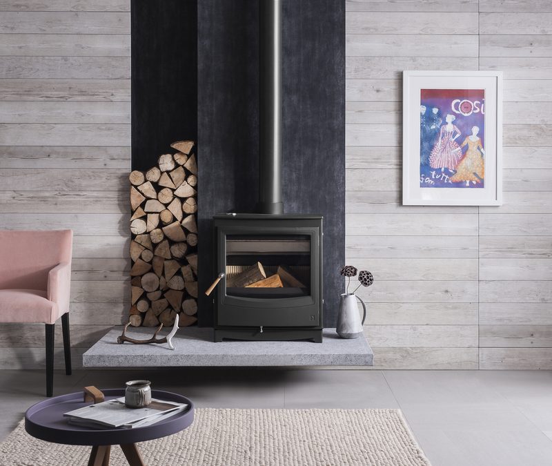 Arada Farringdon Catalyst stove installed with visible flue pipe and proper hearth clearances